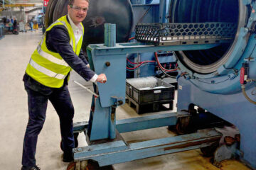 James Frith, MP for Bury North, loading a furnace at Wallwork Heat Treatment