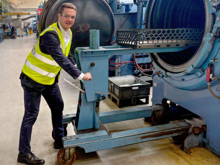 James Frith, MP for Bury North, loading a furnace at Wallwork Heat Treatment
